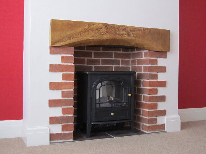 Sussex Red multi brick slips used for a classic fireplace chamber with quoin detailing at the sides