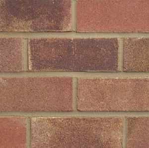 A panel of LBC Heather brick slips. The bricks are a blend of colours including browns, pinks and deep plums. All the bricks have a sand coated finish and very precise edges.