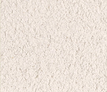 A swatch image of pure chalk mortar. It is an off white colour with a sandy textured finish