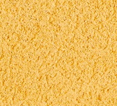 A colour swatch of a yellow mortar. The mortar is a strong mustard yellow tone with a sandy surface texture